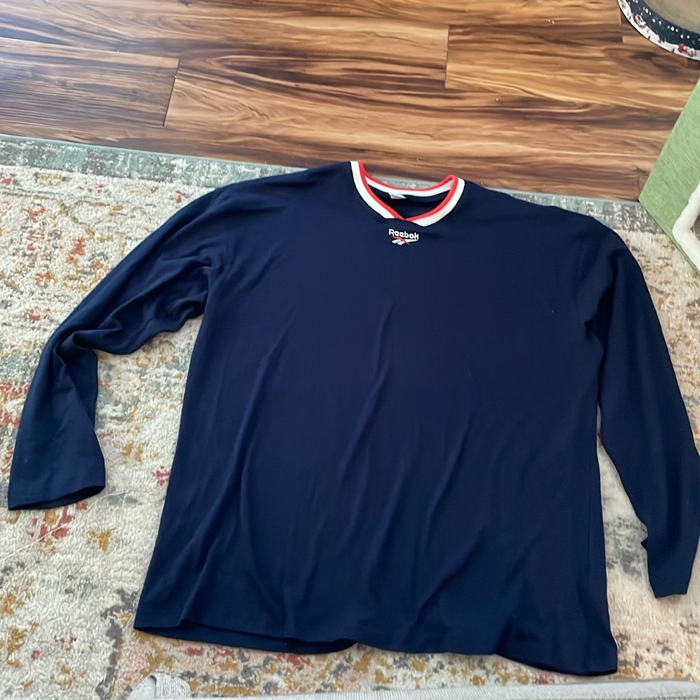 Reebok Navy Long sleeve with orange and white neck and logo